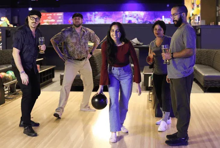 Adults bowling in their own shoes at Splitsville Bowl