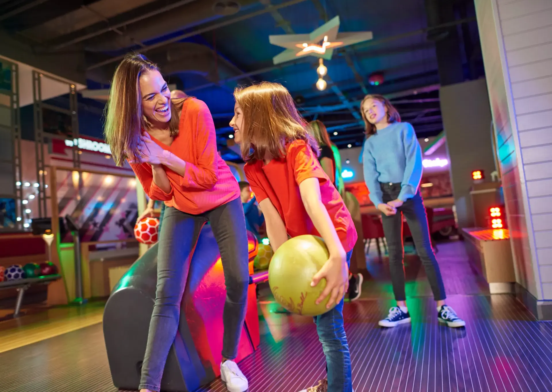 Girl bowling with Mum at Hollywood Bowl