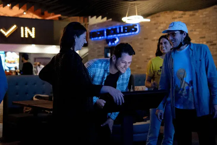 Friends bowling at Stoked by Splitsville Bowl