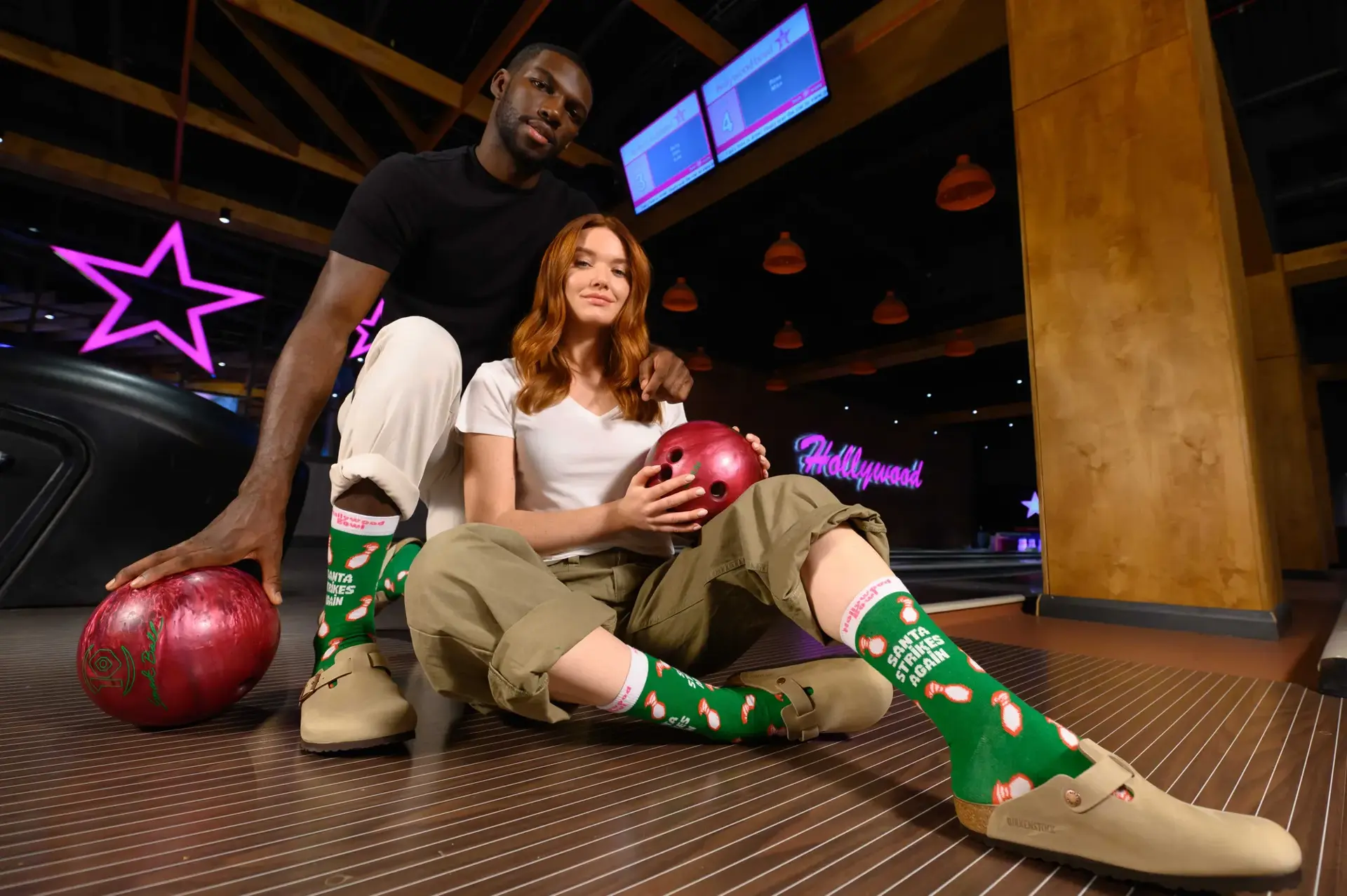 Couple Wearing HWB Socks & Bowling Balls