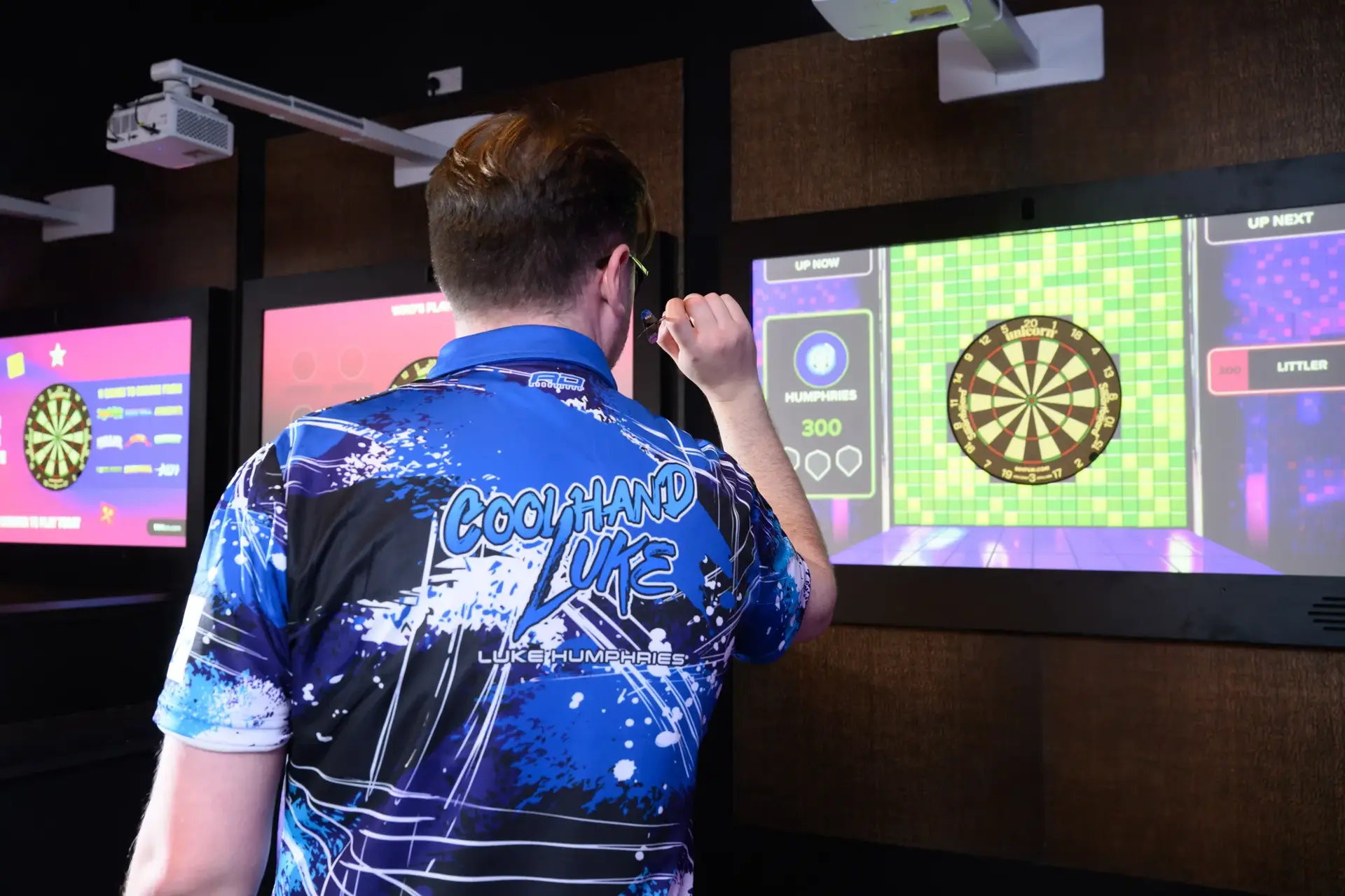 A man playing darts at Hollywood Bowl Norwich