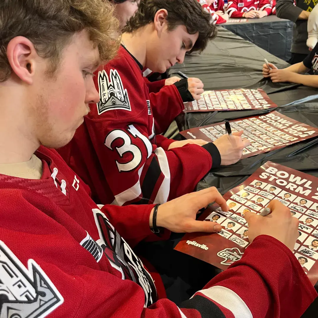Guelph Storm players signing autographs at Splitsville Guelph