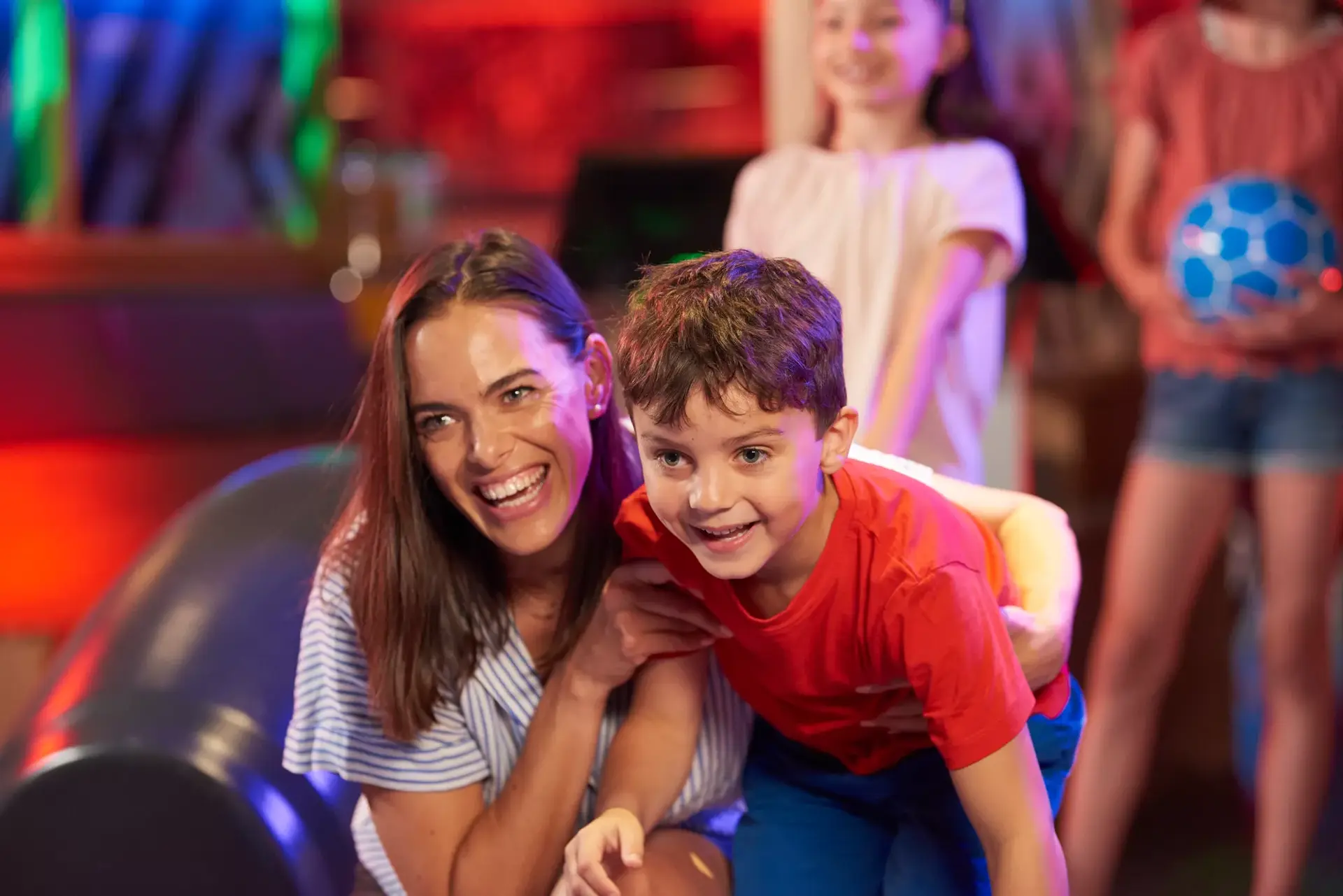 A mother and her child bowling at Hollywood Bowl