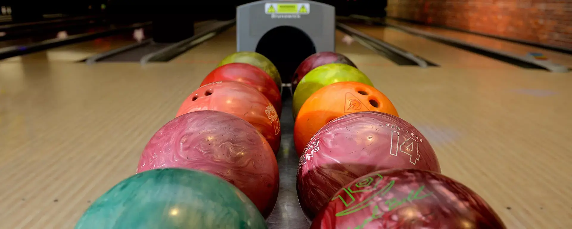 Bowling balls on lanes at Hollywood Bowl Cwmbran