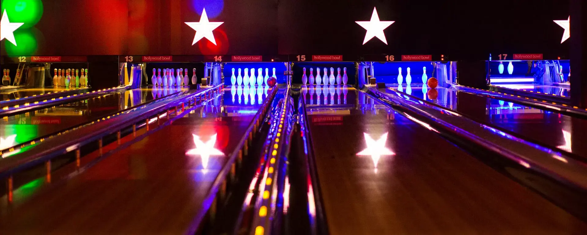 Bowling lanes at night at Hollywood Bowl Birmingham Broadway Plaza
