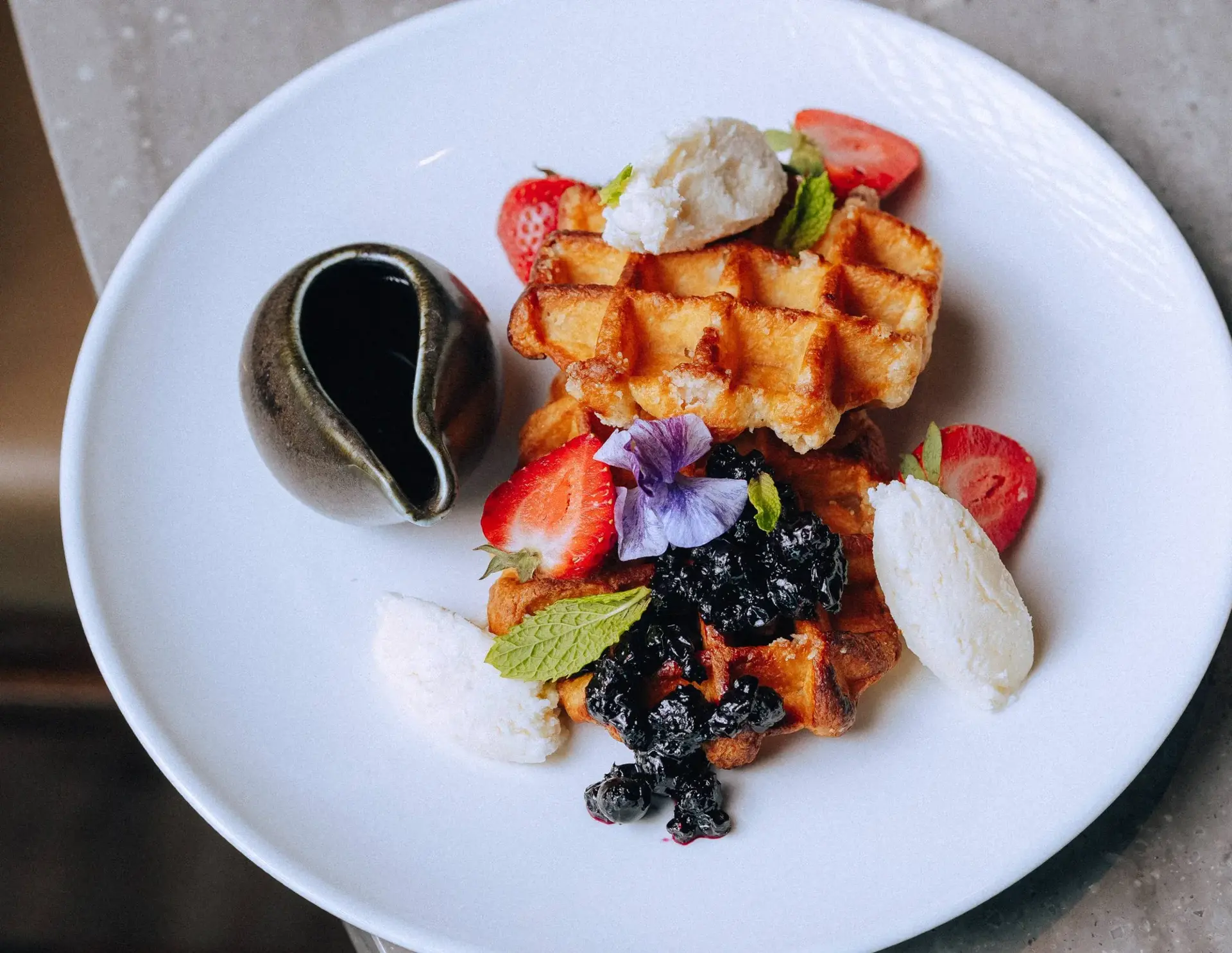 A plate of waffles at Stoked Kitchen and Bar