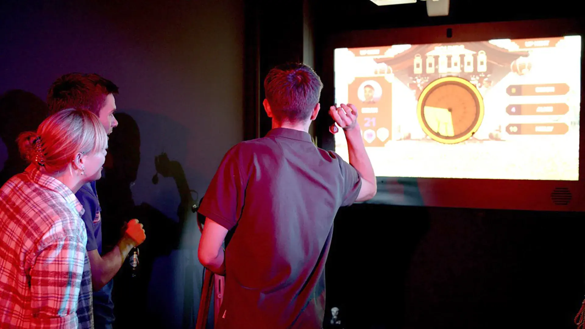 Friends playing darts