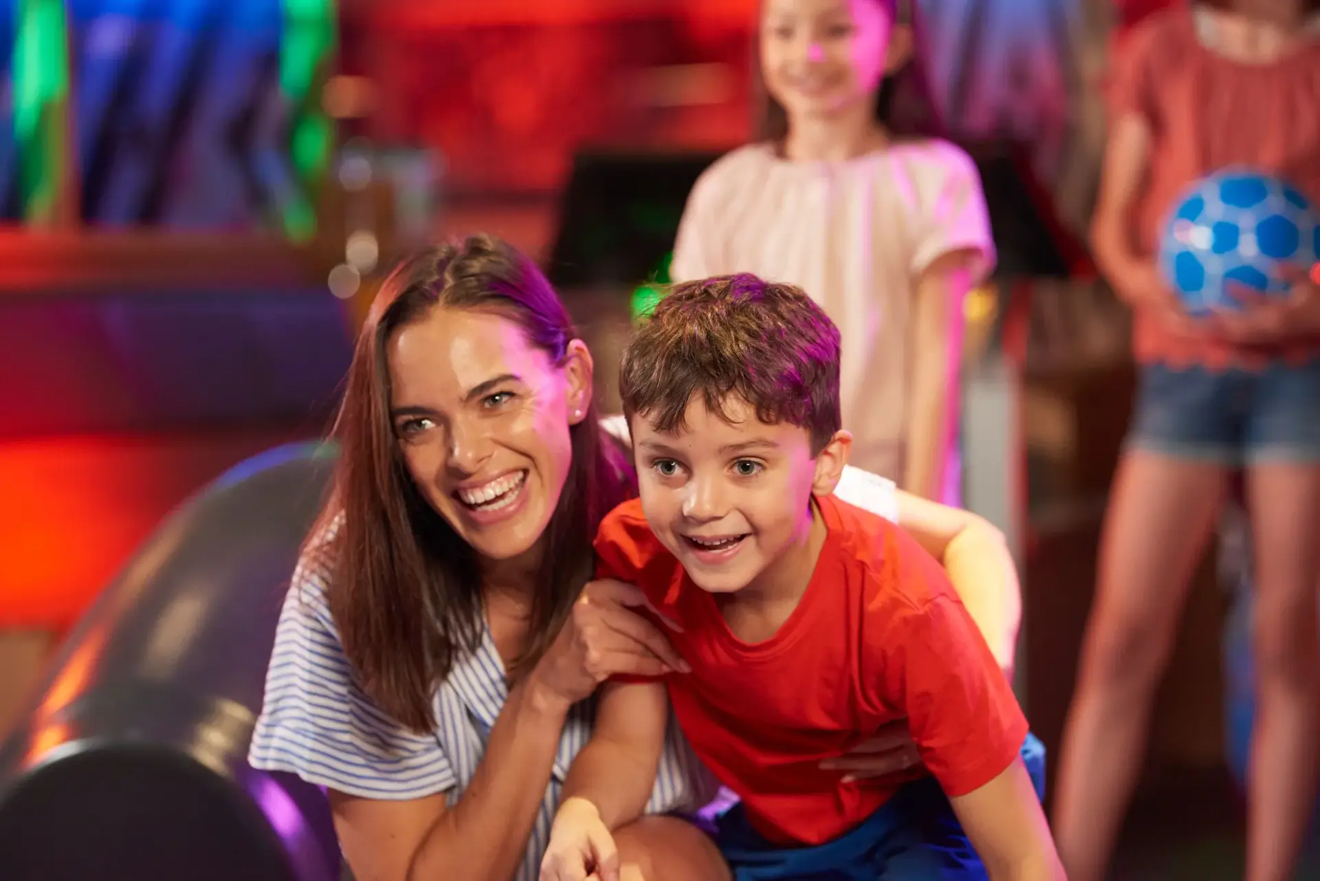 A mother and her child bowling at Hollywood Bowl