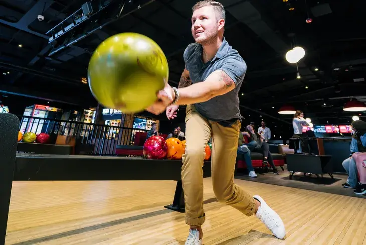 Man bowing at Splitsville for All You Can Bowl on Sunday nights