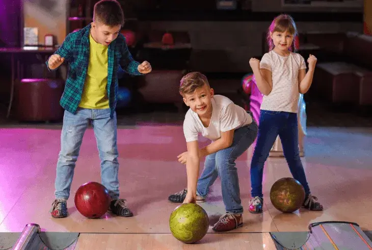 Children bowling in their own shoes at Splitsville Bowl