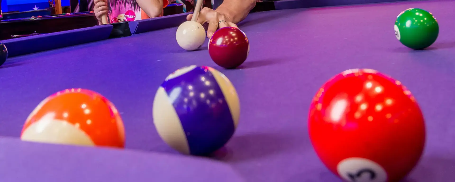 Family playing pool at Hollywood Bowl Norwich