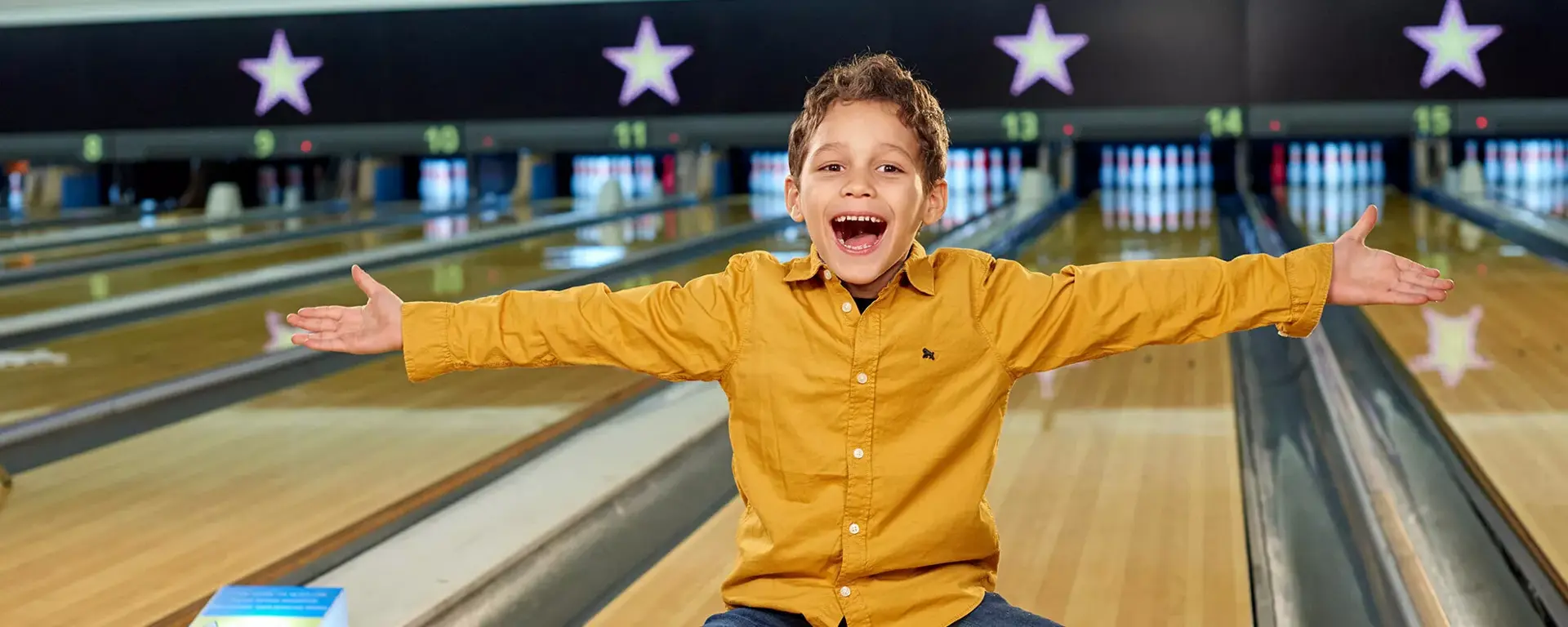 Young boy having fun on the lanes