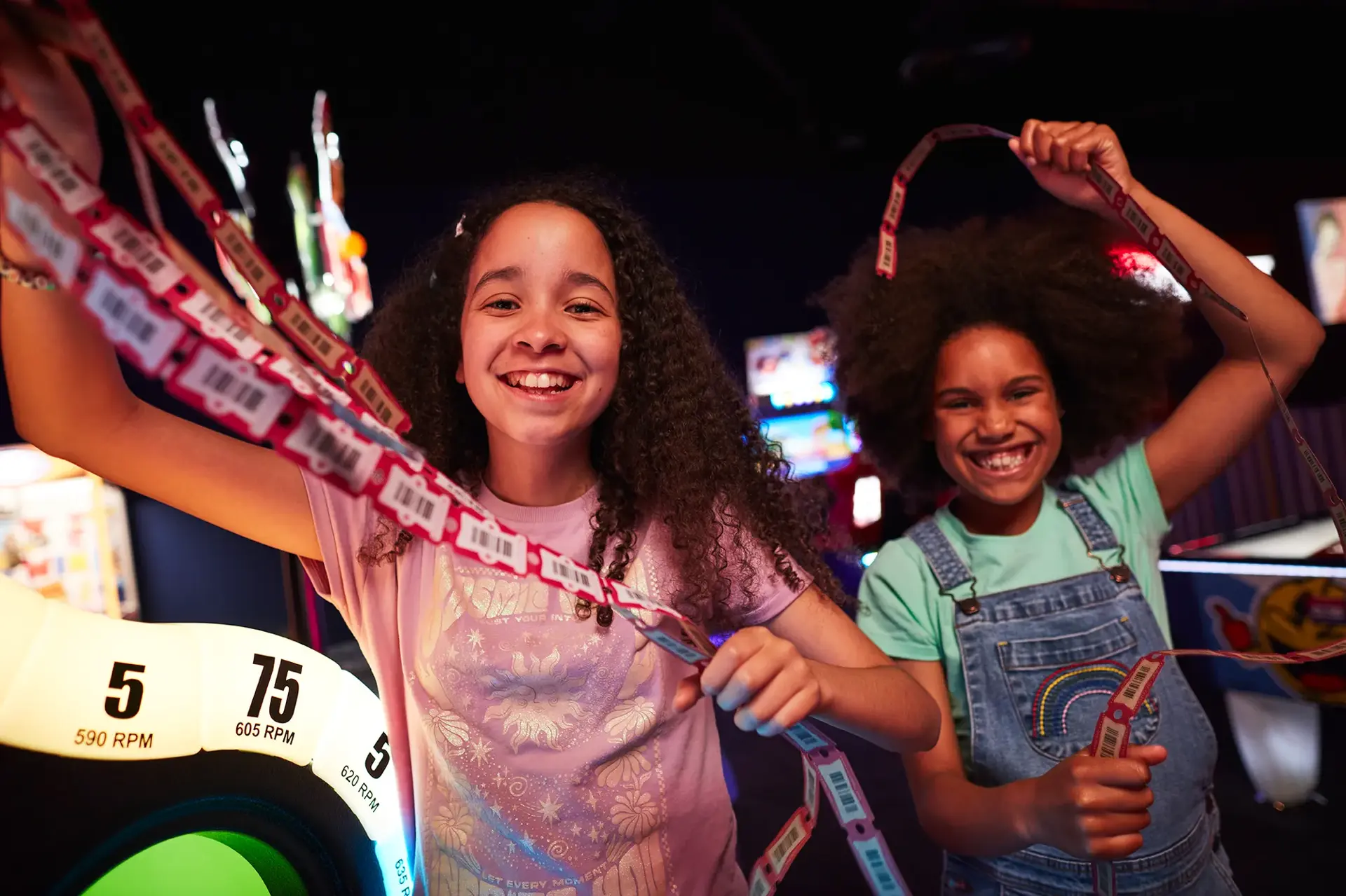 A family playing arcade games at Hollywood Bowl centre