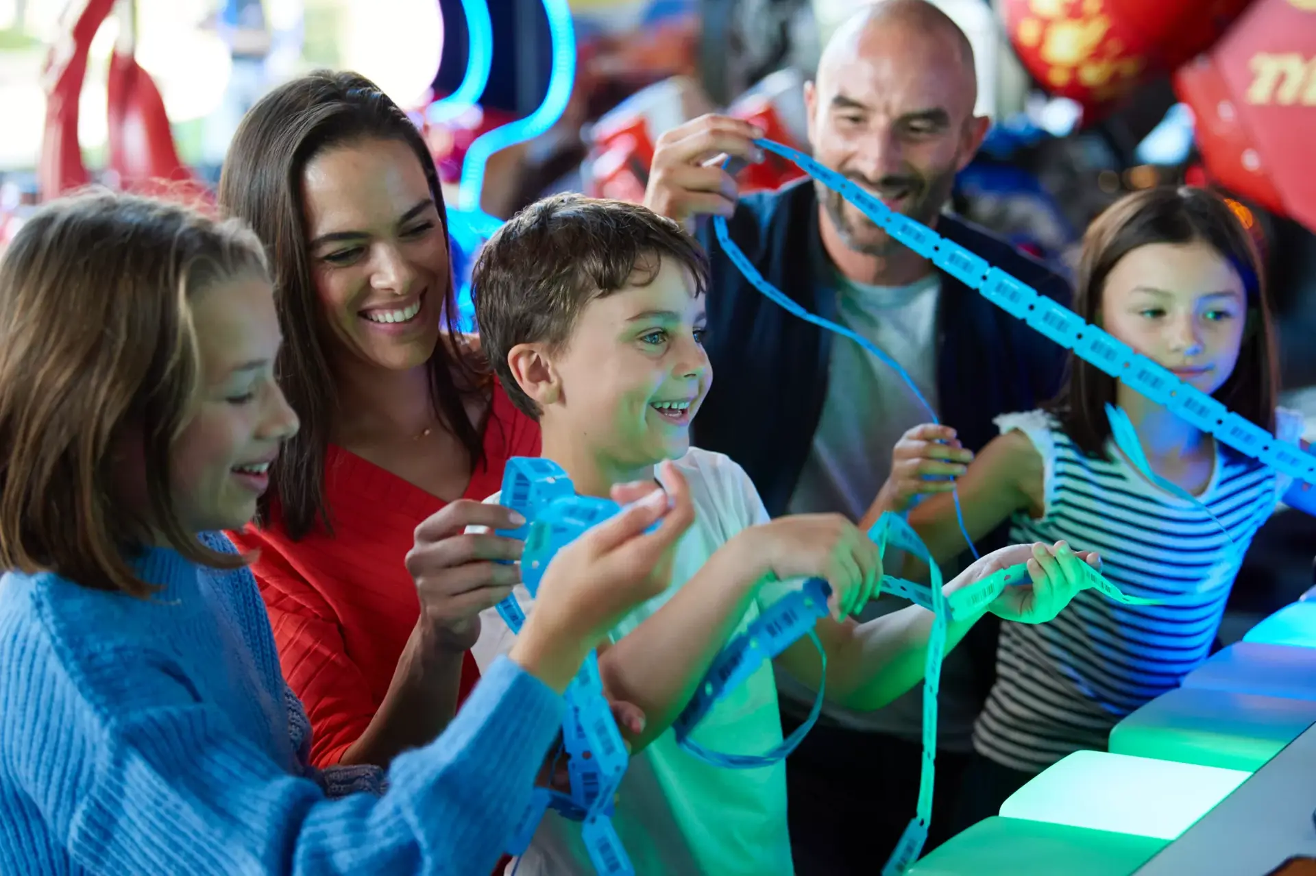 Family winning tickets at Hollywood Bowl arcade