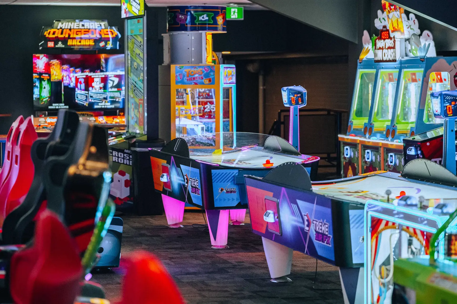 An exciting game room featuring a variety of arcade machines and games, perfect for gaming enthusiasts and friends.