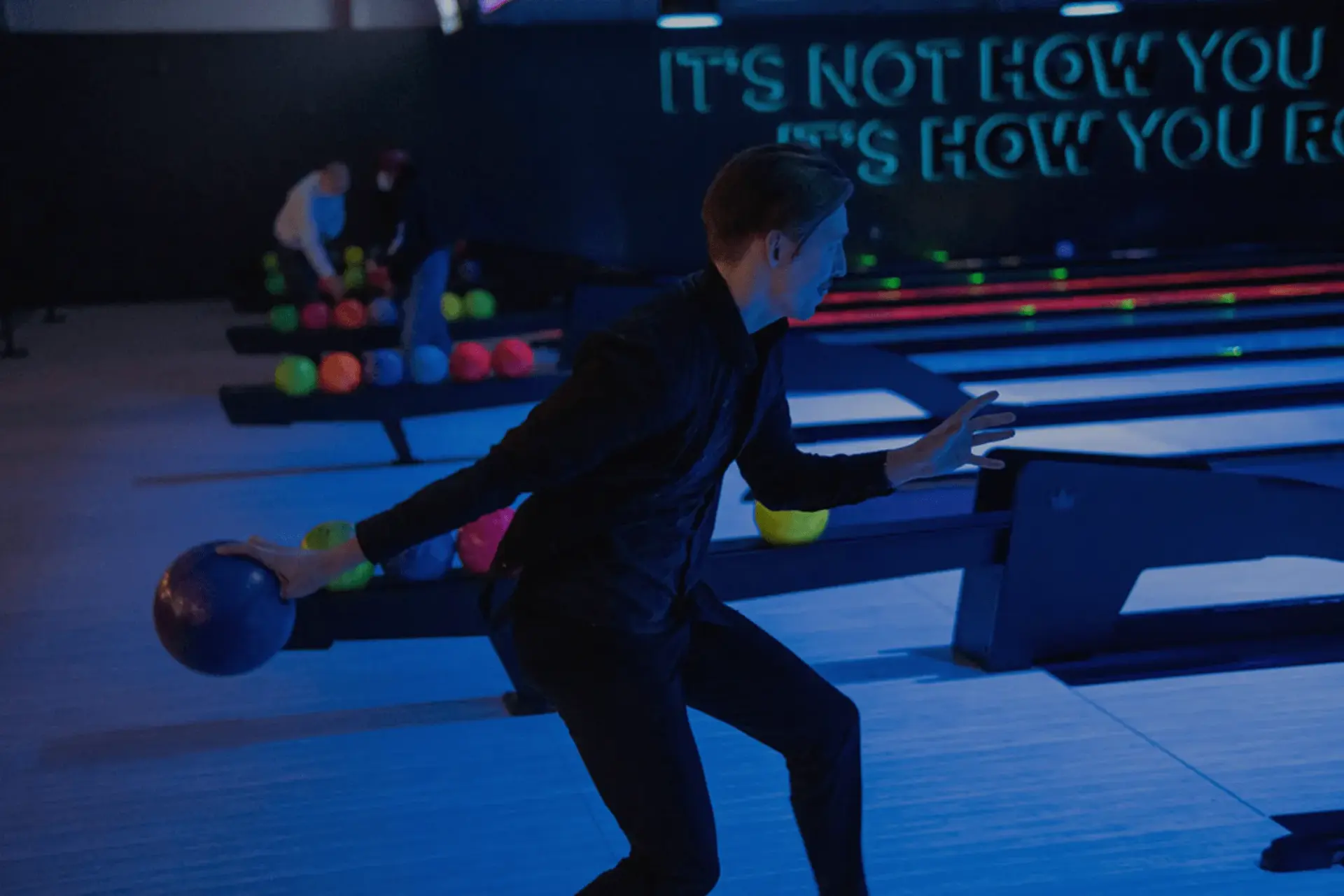 A man bowling at Splitsville Bowl
