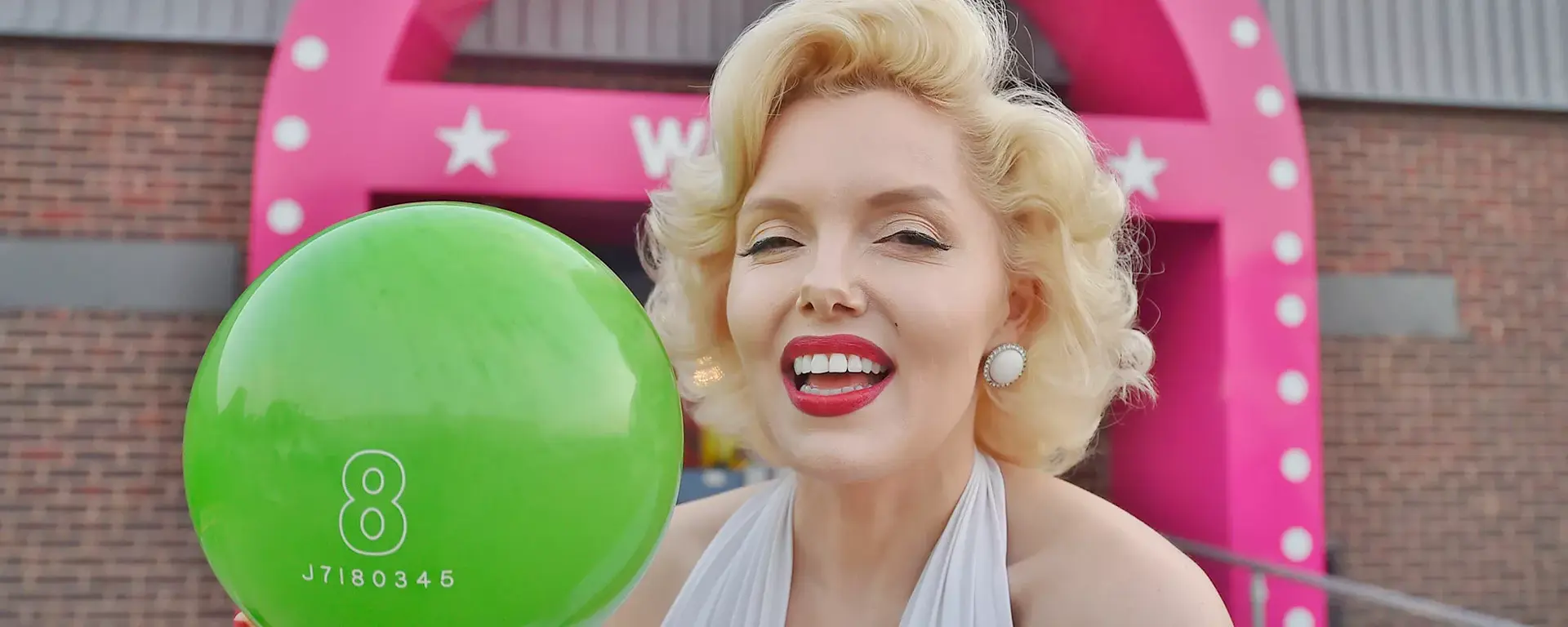 Marilyn Monroe holding bowling ball outside Hollywood Bowl Peterborough