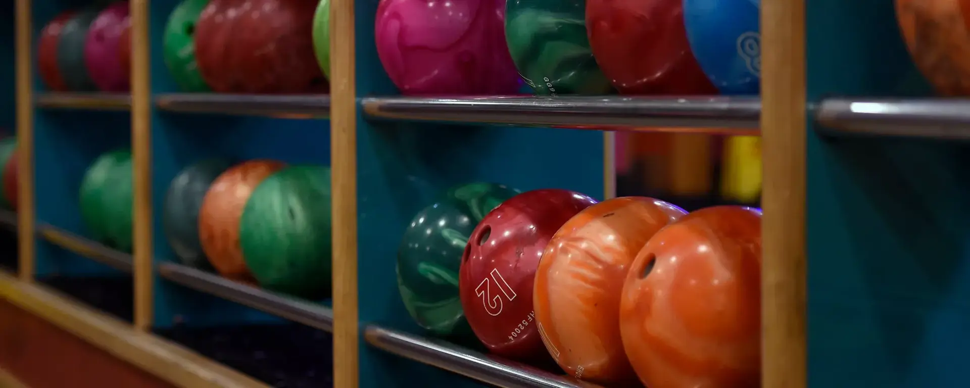Bowling balls stacked at bowling alley