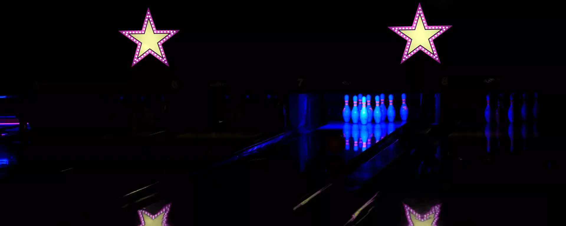 Lit up lanes and pins at night at Hollywood Bowl