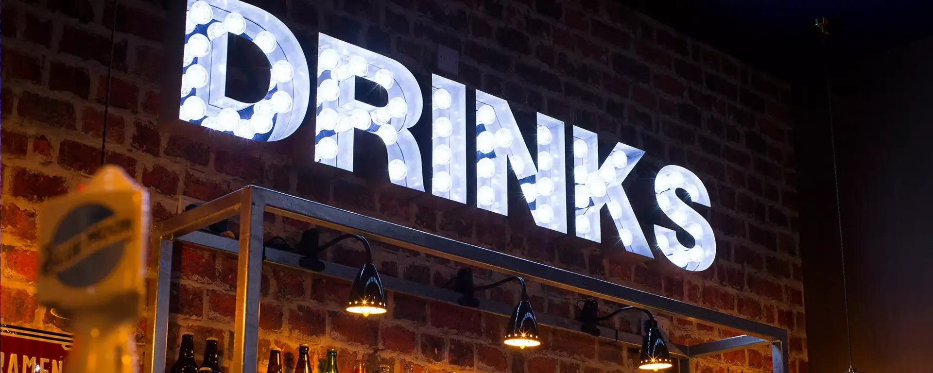 Drinks sign at the bar at Hollywood Bowl Birmingham Broadway Plaza