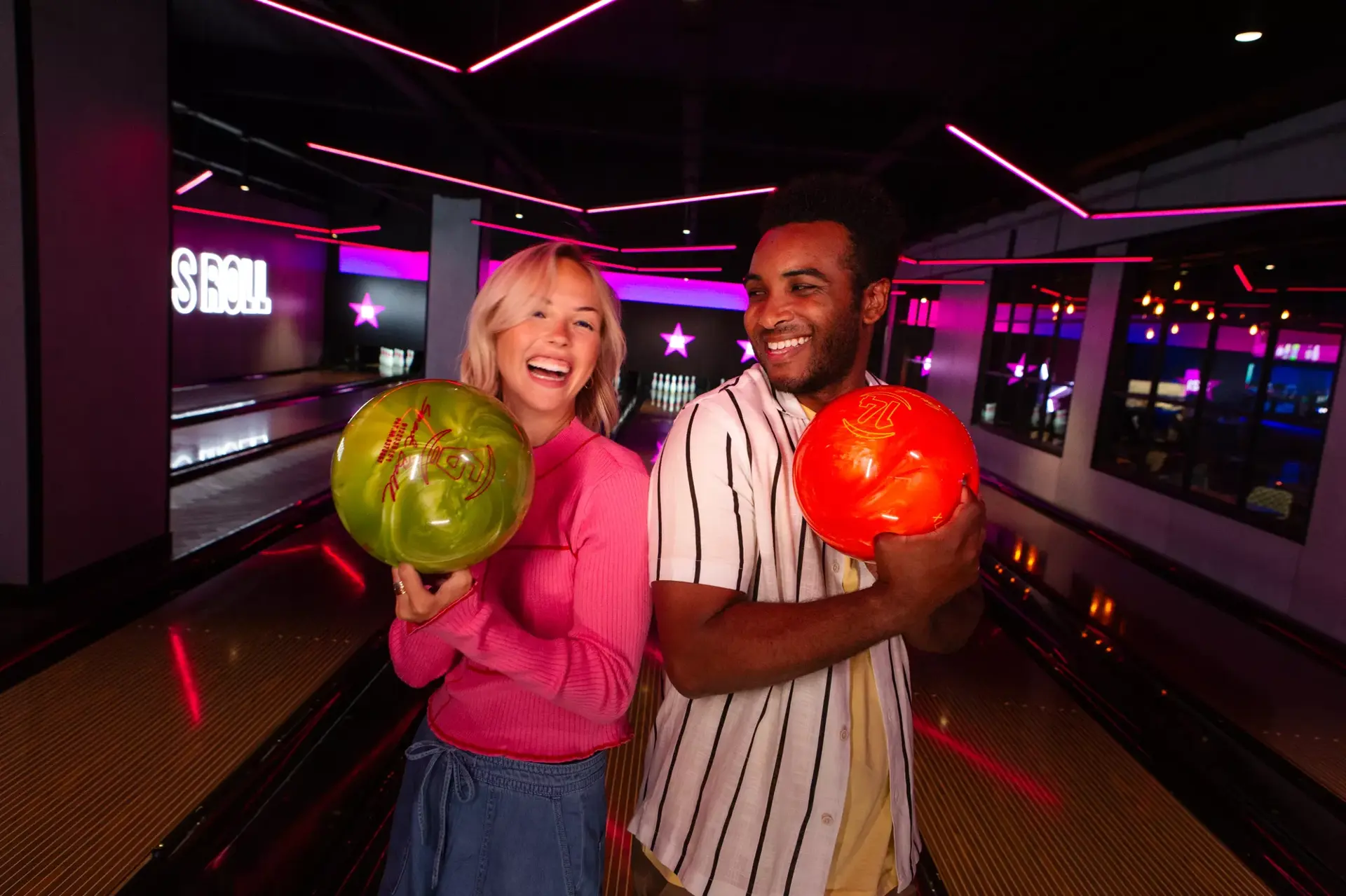 Group of people playing a game of bowling