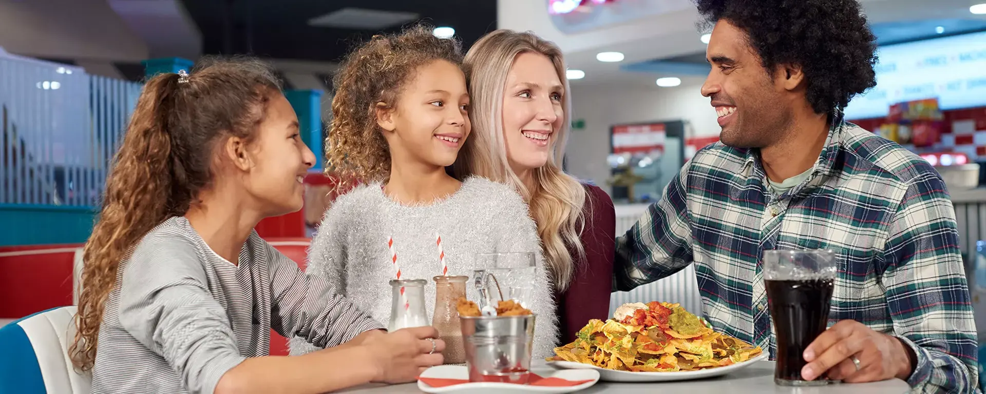 Family enjoying food in the diner at Hollywood Bowl