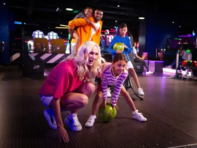 Family having fun on the lanes at Splitsville