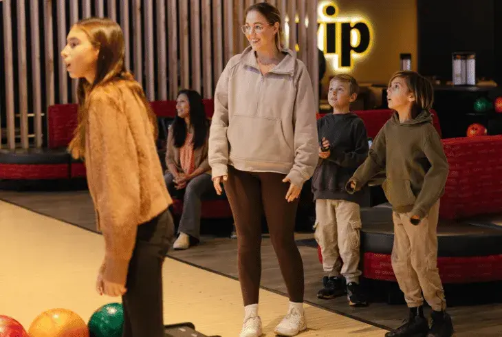 Kids bowling with their team at Splitsville Bowl